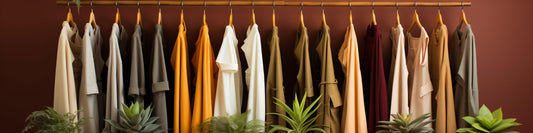a closet in a store with hanging down from racks and plants, in the style of pastel colors, consumerism critique, beige and amber, colorful washes, site-specific, zen-inspired, street-savvy