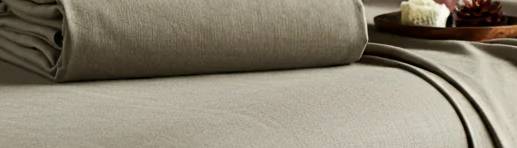 How does silk compare to linen in terms of breathability for massage sheets