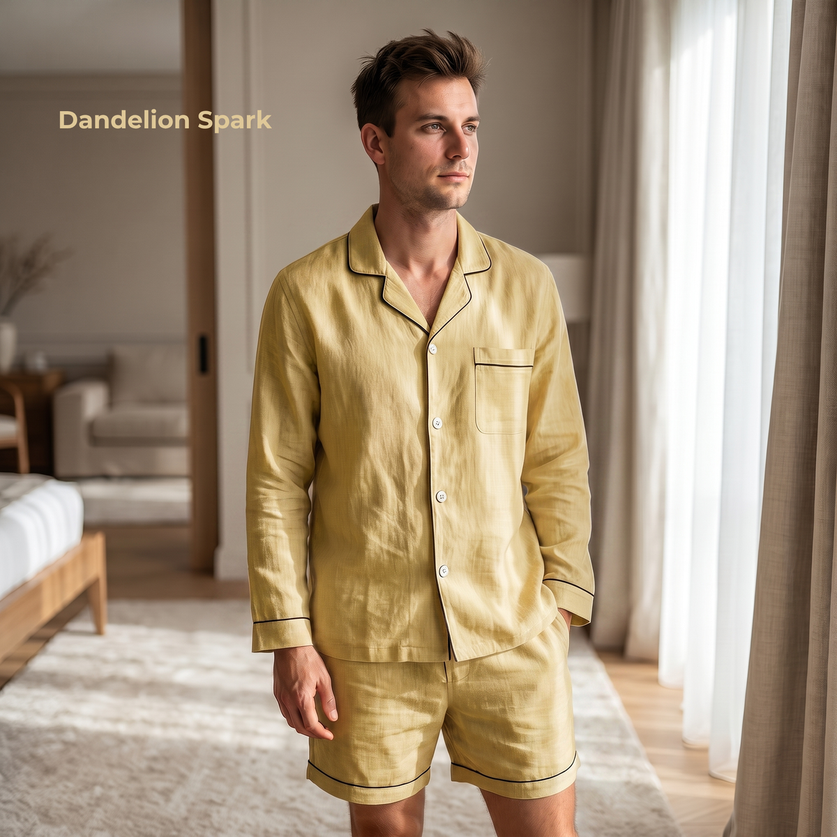 Man wearing a yellow pajama set in a bedroom with 'Dandelion Spark' branding.