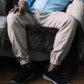 Men's linen joggers in Cloud Haze, seated – OrganoLinen