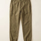 Men's linen joggers in Olive Earth, flat lay – Axel by OrganoLinen